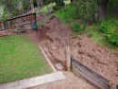 [thumbnail of what the hill removal portion of my retaining wall / fence project looked like, early on.]