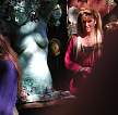 [button photo of a Renaissance Faire sculptress with her wares]